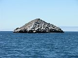 Galapagos 6-1-18 Cousins Rock Back at the beach, we boarded the pangas and headed back to the Eden for lunch. As we sailed towards Bartolome, we passed Cousin's Rock, a well known dive site situated off the east coast of Santiago.